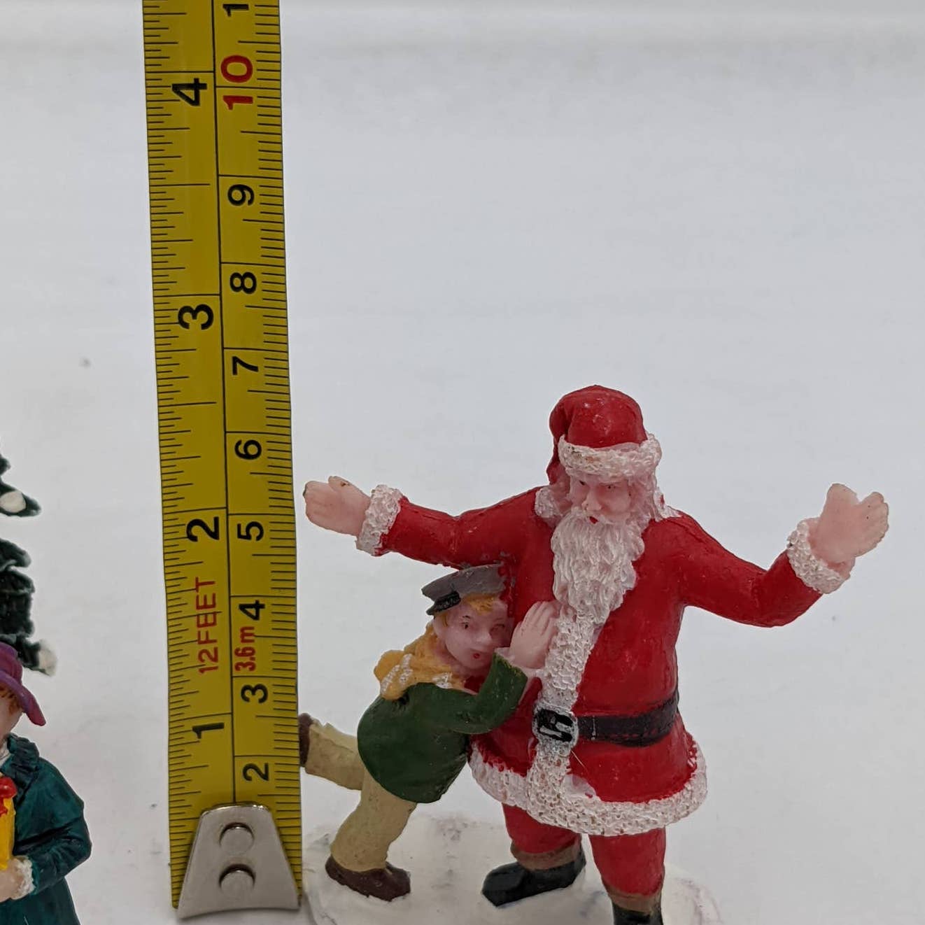 Lemax Christmas Figurines Hugging Santa Claus Tree